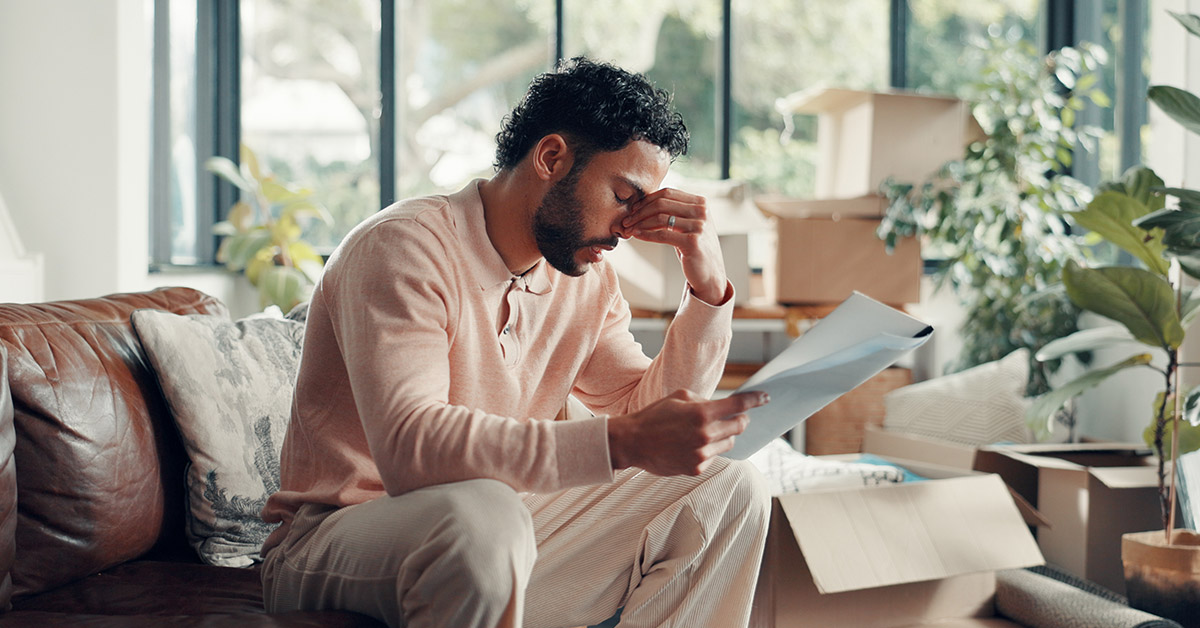 Delayed home closing Massachusetts seller reviewing closing documents