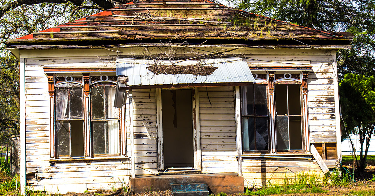 Uninhabitable house in Massachusetts with extensive damage and major repairs needed before occupancy